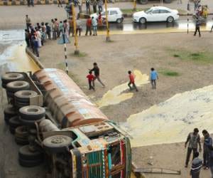 Filled with liquid soap tanker overturned on the highway