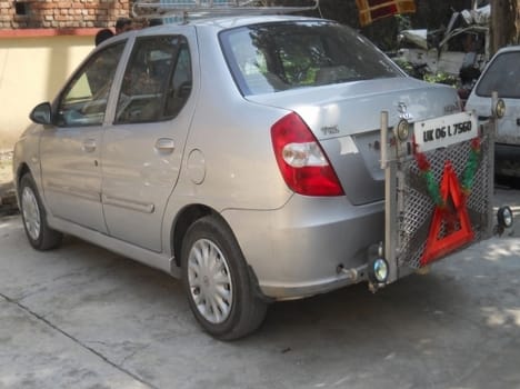 man ride car in back gear