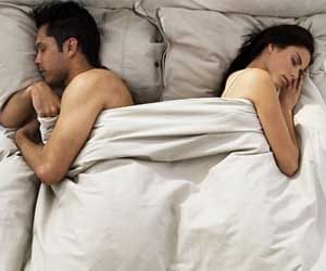 Happy couples sleep only an inch apart