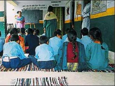 student sitting on mat
