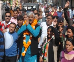 Cabinet minister Dinesh Agarwal walks