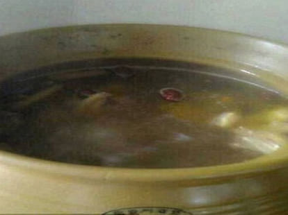 women made soup of cat