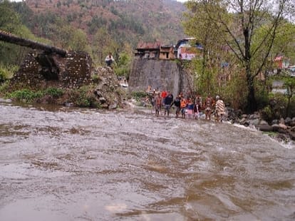 children have to cross river to arrive at school in narmand