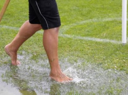 Indian player plays football barefoot during training session