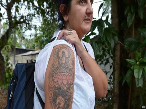 a tattoo increased difficulty British woman tourist