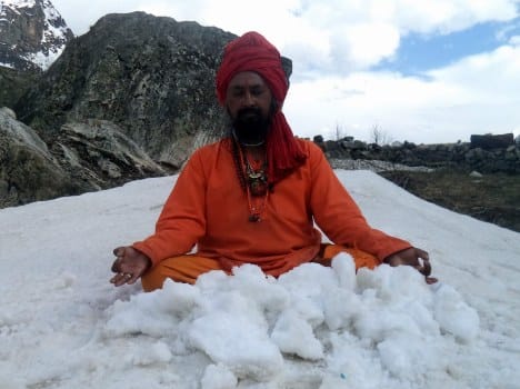 priest doing worship on snow