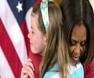 who gives biodata to barak obama's wife?