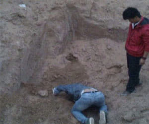 100 puppies buried alive
