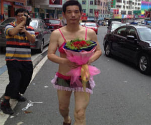 man proposes in bikini