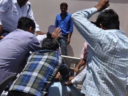 police beaten by villagers