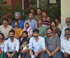 Businessman sitting on dharna with family
