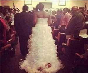 mother tied newborn to her gown on wedding day