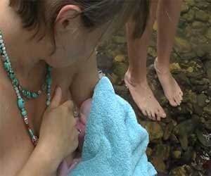 mother gives birth in nude state in a forest alone
