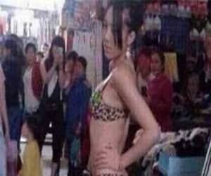 girl roams in the market flaunting bikini