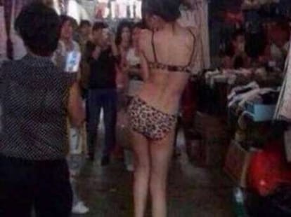 girl roams in the market flaunting bikini