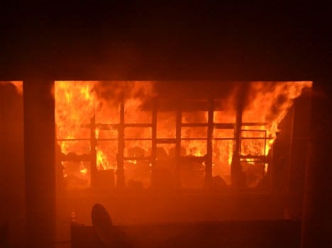 Couple beaten, then put in a restaurant fire