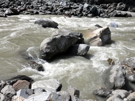 three people swept away in flow.