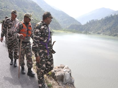 two engineer swept in river chamelia