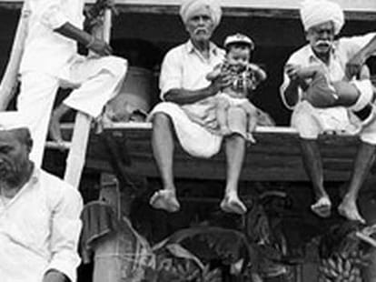 babies being tossed from atop for good luck