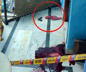 shot to Two businessmen, one killed 