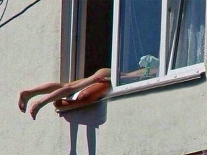 Austrian sunbather causes car pile-up after hanging naked out of her window