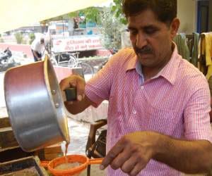 National Football Coach Selling Tea on Road