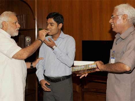 staffer son clears upsc modi greets
