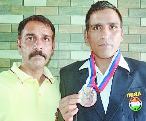 Bhushan wins Silver medal in mix martial arts