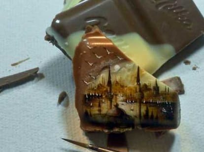 man who paints on dry fruits and chocolates