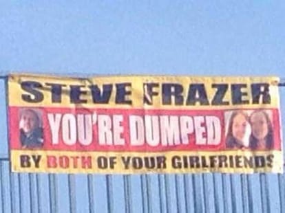 women hang banner of their flirt banner