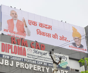 narendra modi's photo on congress leader's hording