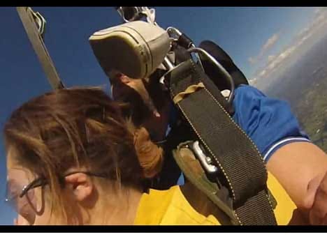 skydiver is whackd in the air by flying trainer