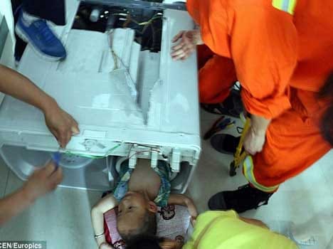 babuy stuck inside washing machine