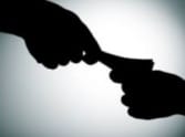 EASI caught red-handed in taking bribe.