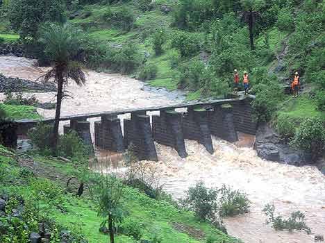 two young men stranded in river ravi