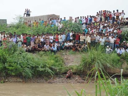 two students swayed in canal