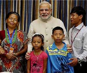 pm narendra modi meets nepali family with their son