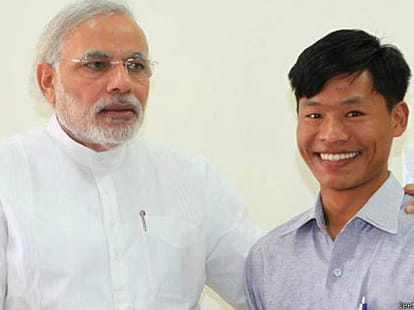 pm narendra modi meets nepali family with their son
