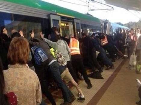 perth commuters lifts train top escape leg stuck man