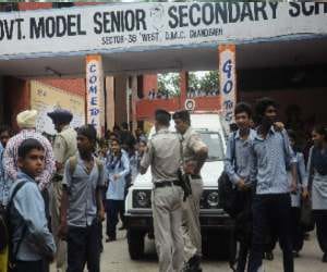  students _studded lock_school gate