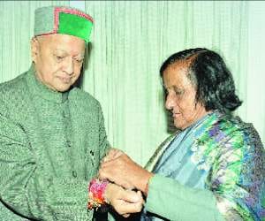 Cm virbhadra singh sister mena dev tied rakhi on his wrist