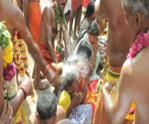 people flock to get their heads smasdhed from coconuts