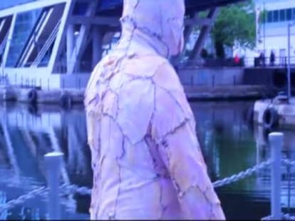 man walks out wearing body suit made of chicken