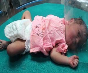girl child  thrown into the bushes, Mother arrested
