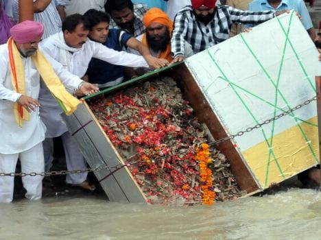 martyrs' bone immerse into holy ganga