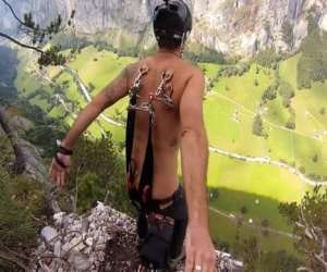 man hooks himself with parachute