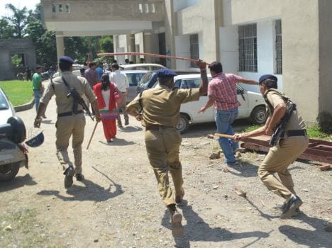 employees beaten by police.
