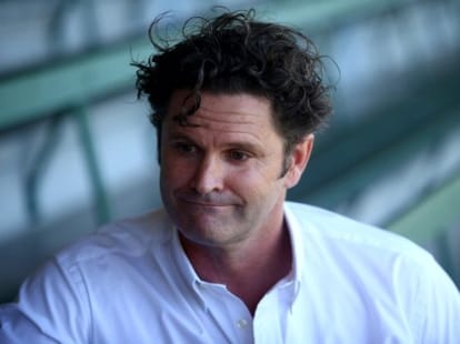 Chris Cairns cleaning bus shelters to provide for his family.