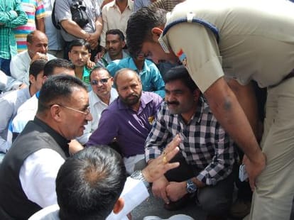 policemen beaten four villagers.