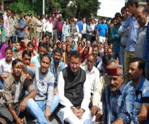 policemen beaten four villagers.